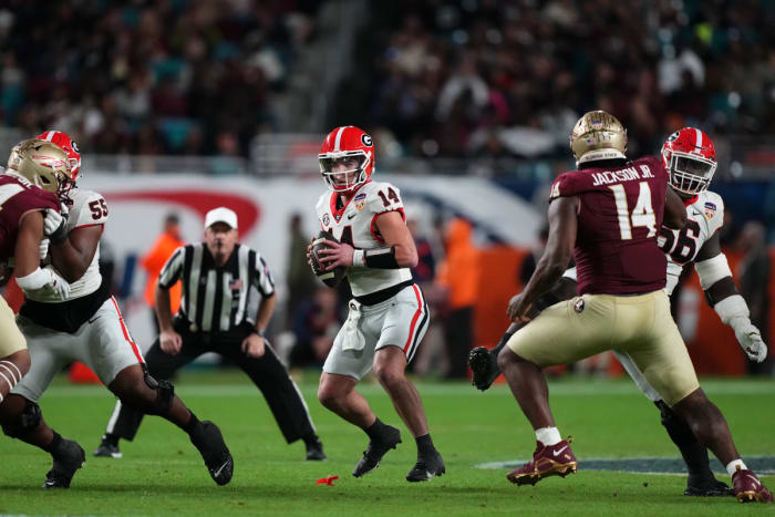 Dec 30, 2023; Miami Gardens, FL, USA; Georgia Bulldogs quarterback Gunner Stockton (14) drops back to pass Florida State Seminoles during the second half in the 2023 Orange Bowl at Hard Rock Stadium.© Jasen Vinlove-USA TODAY Sports